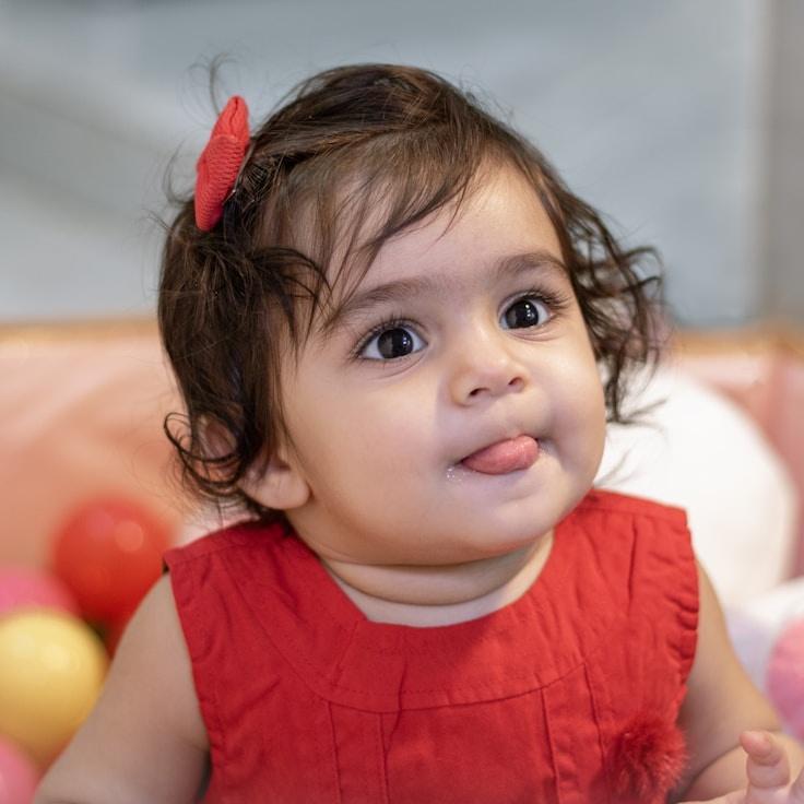 Kaveri Mehta, Lead Design Curator at StreamStudioHaven, reviewing corporate floral arrangements